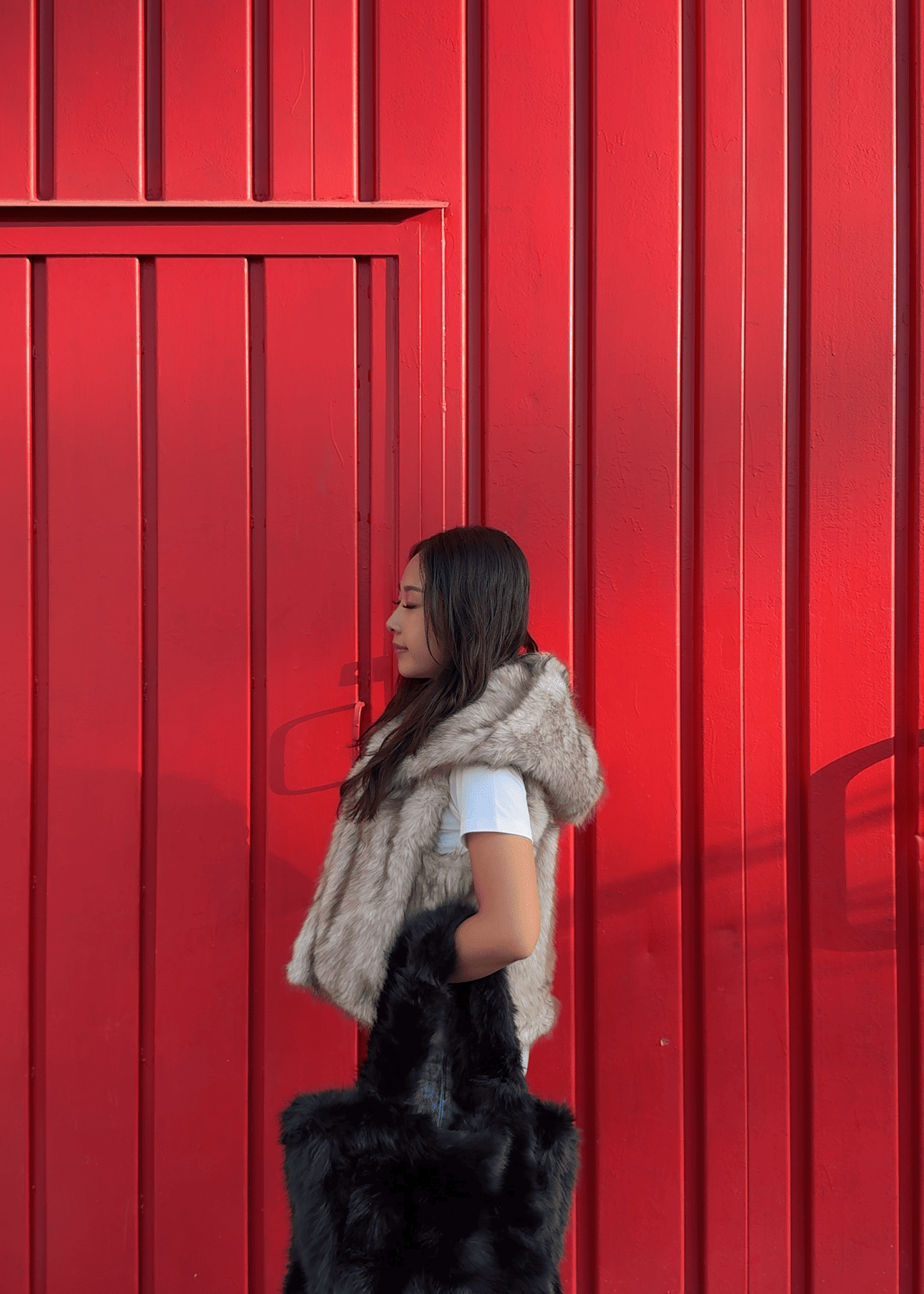 Gilet in pelliccia sintetica con cappuccio