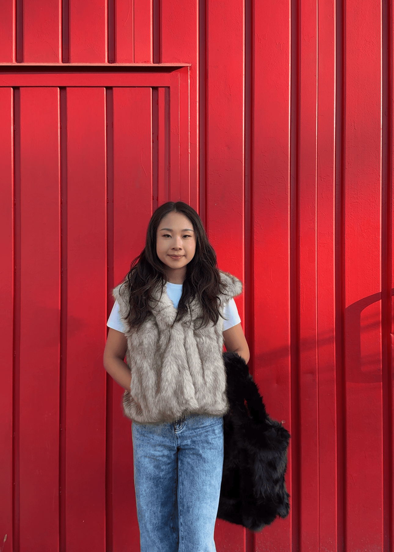 Gilet in pelliccia sintetica con cappuccio