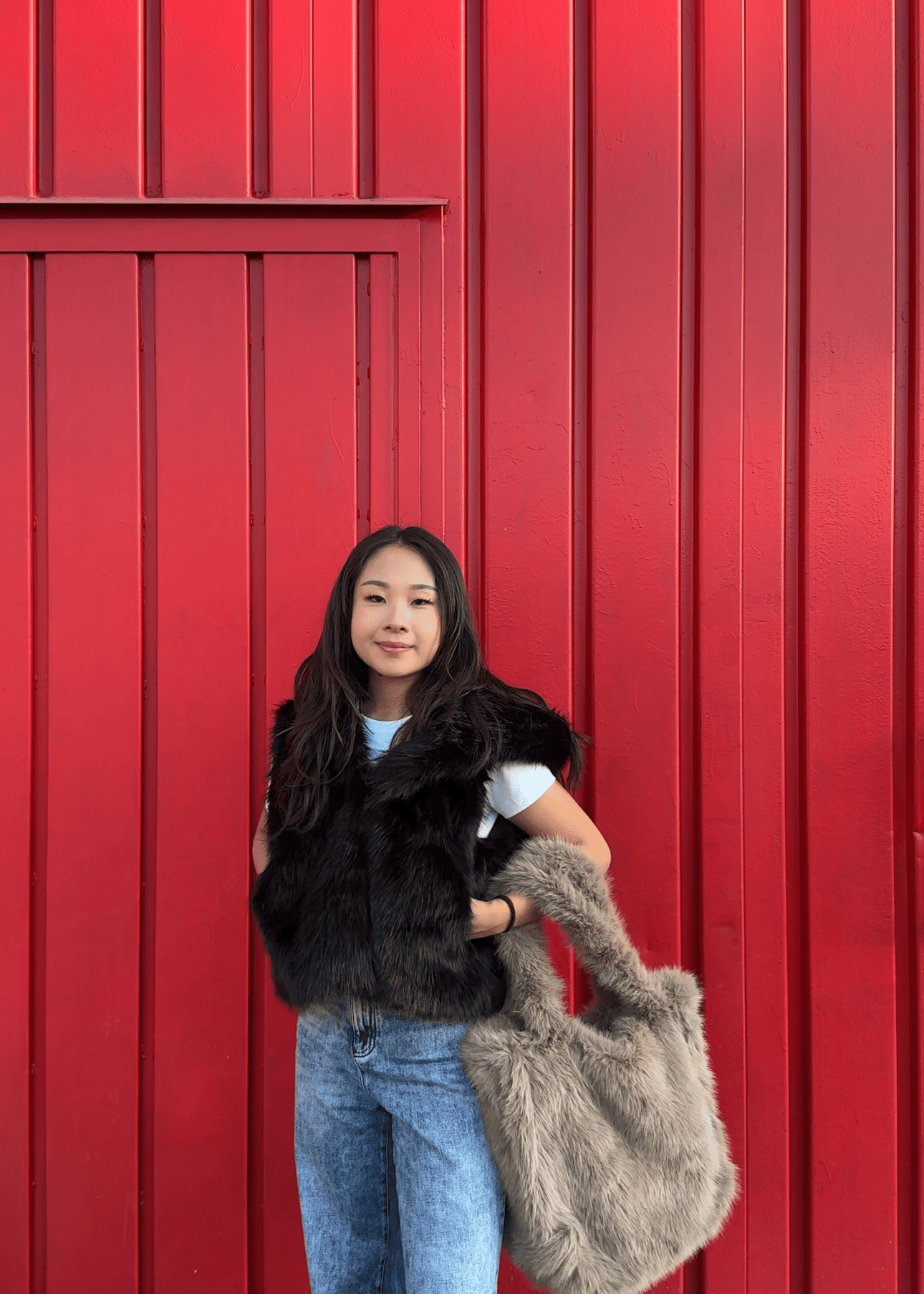 Gilet in pelliccia sintetica con cappuccio