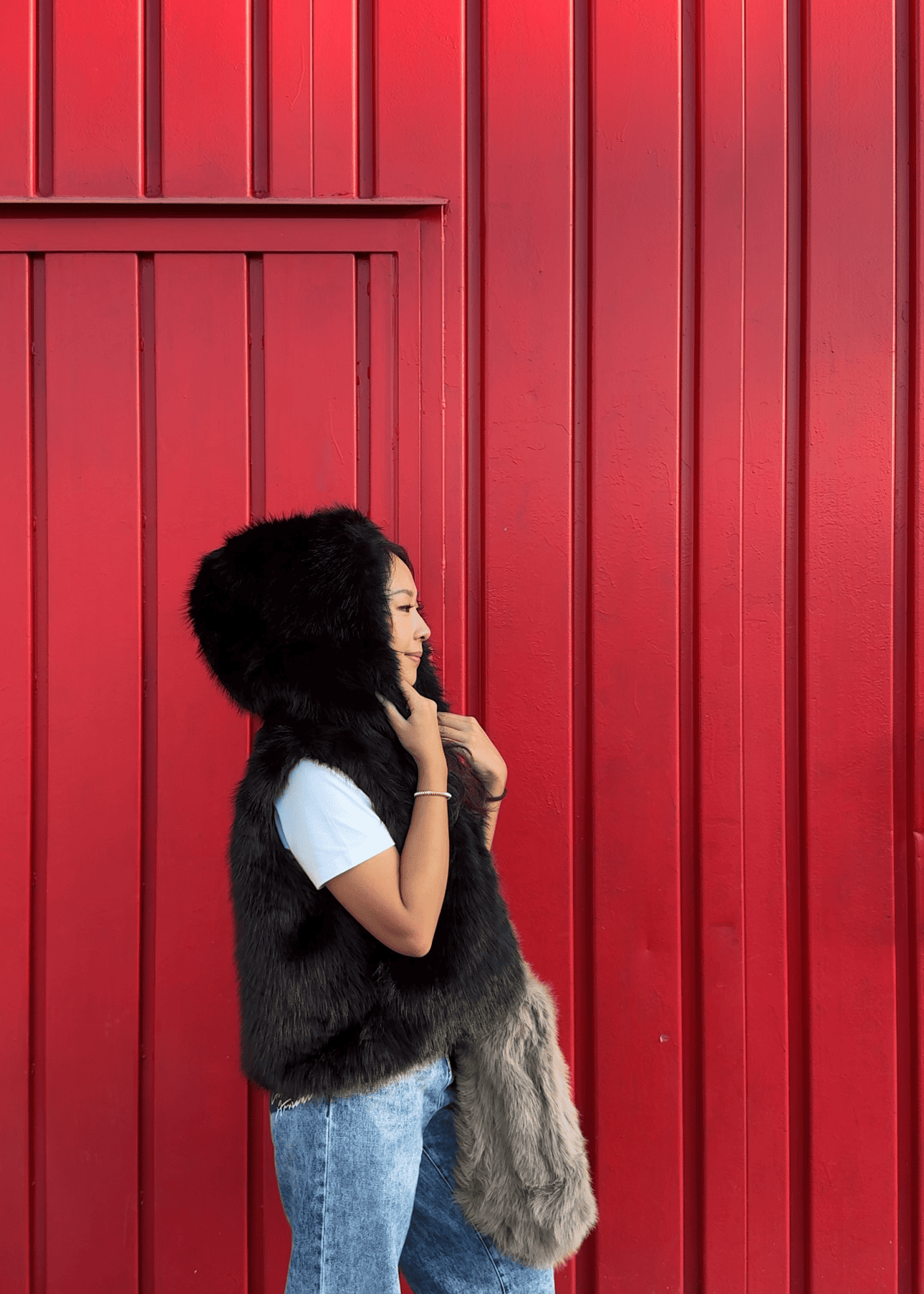 Gilet in pelliccia sintetica con cappuccio